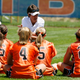 Softball girls (not me) plot against their coach